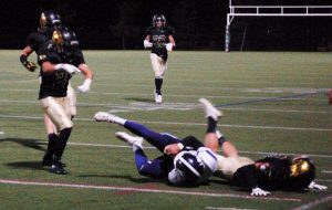 A Mountain Vista defensive player tackles a Douglas County player.