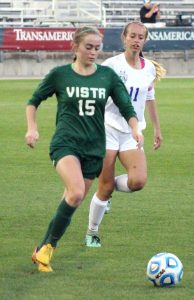 Junior Haley Scheuppert dribbles the ball downfield, towards Grandview's goal. Scheuppert has committed to Clemson to play soccer.