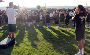 Senior Gannon Rushall leads the marching band in warm ups. Fifty minutes remain before the game.